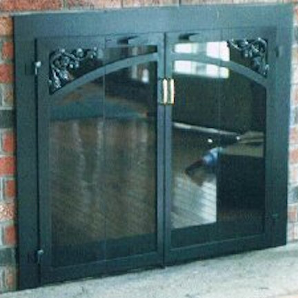 Wide frame Carver fireplace doors all black, vice bi fold doors with brass center handles and standard smoke glass